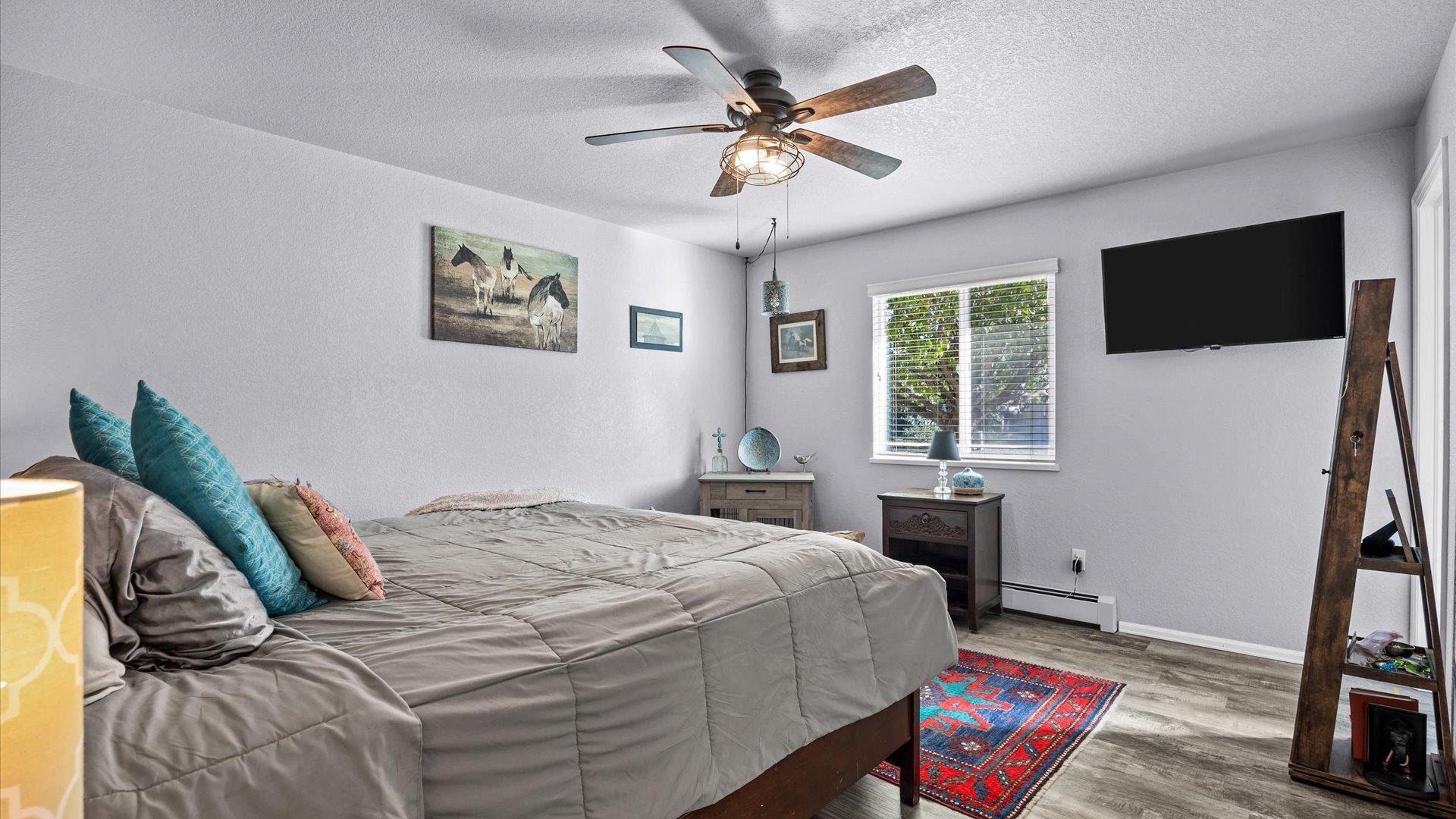 182 Woodstock Street Fruita, CO 81521 - Photo 19 of 31 a bedroom with a bed and a window