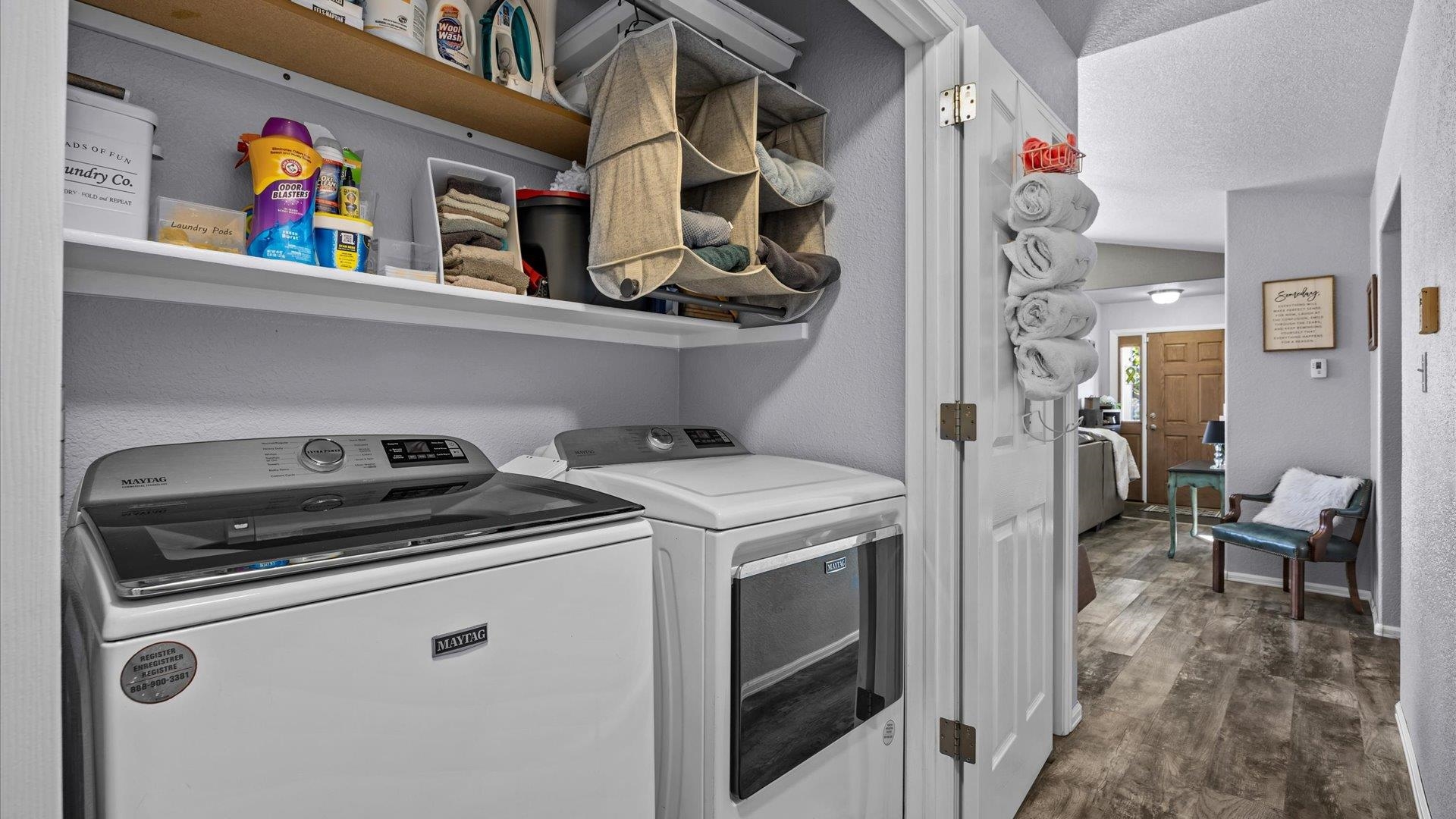 182 Woodstock Street Fruita, CO 81521 - Photo 26 of 31 a utility room with dryer washer and a view of living room