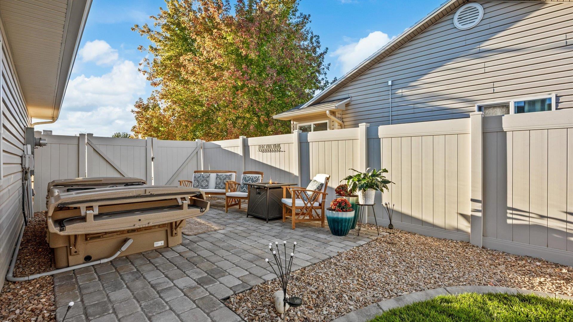 182 Woodstock Street Fruita, CO 81521 - Photo 4 of 31 a view of a patio with a table and chairs and potted plants