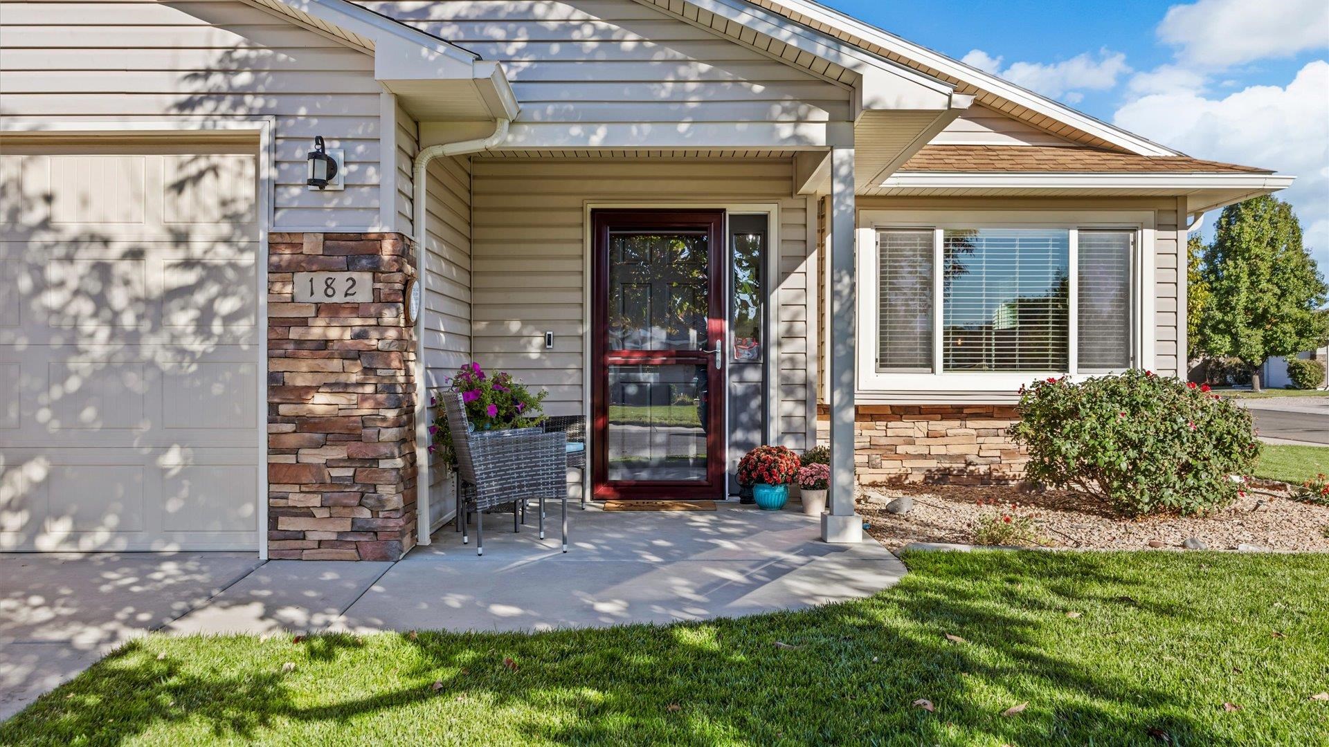 182 Woodstock Street Fruita, CO 81521 - Photo 6 of 31 a view of a house with potted plants and a chair