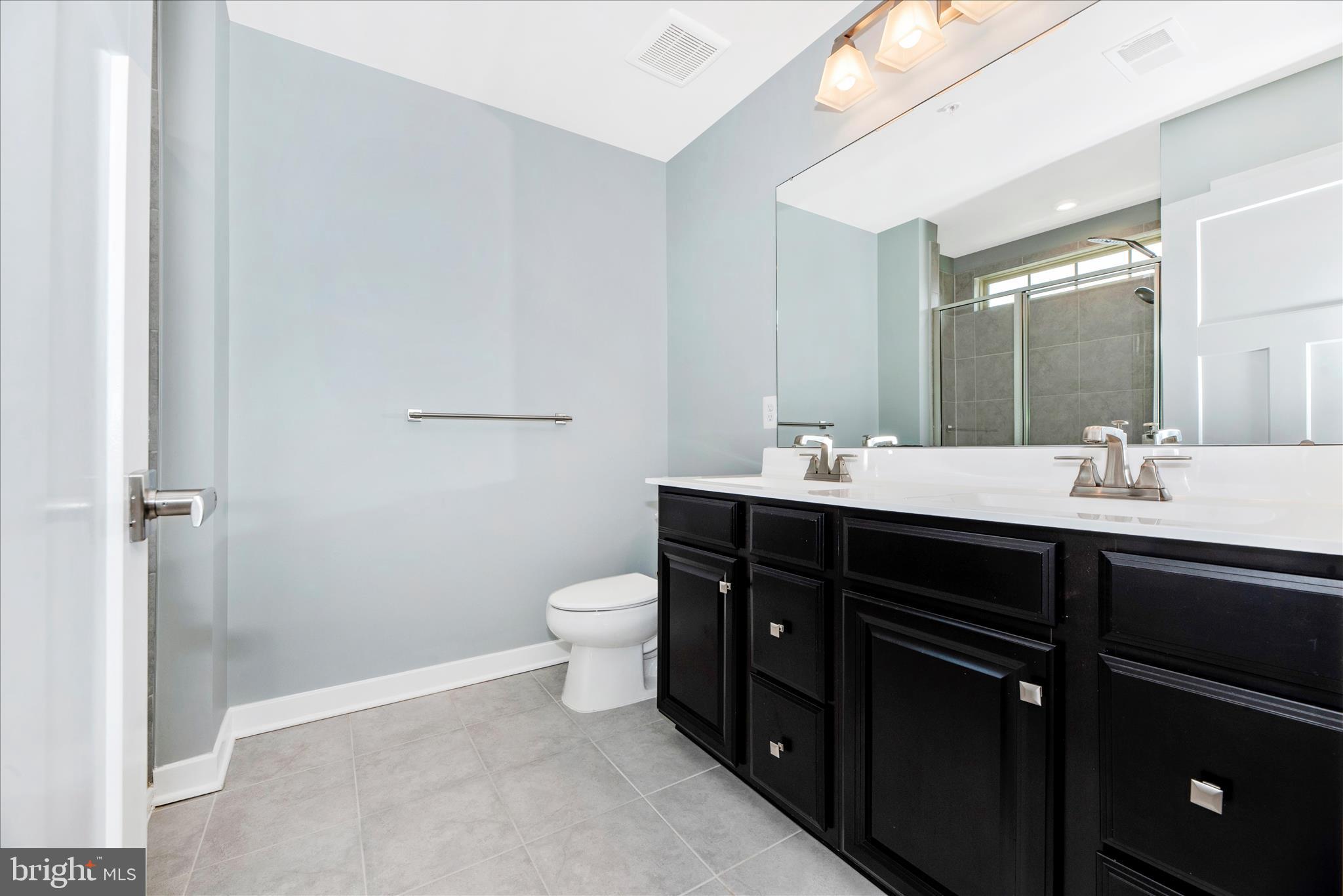 7091 Kokanee Way New Market, MD 21774 - Photo 27 of 69 a bathroom with a sink vanity and a mirror