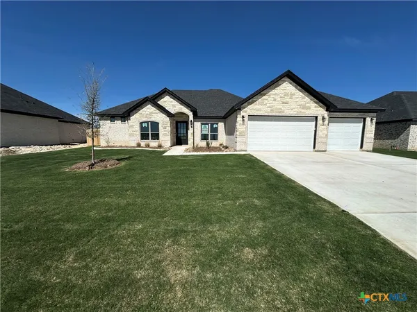 a front view of a house with yard