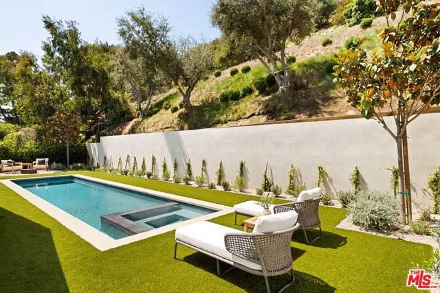 a view of a yard with chairs