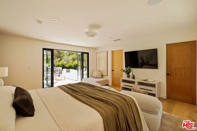 a bathroom with a double vanity sink a mirror and a bathtub
