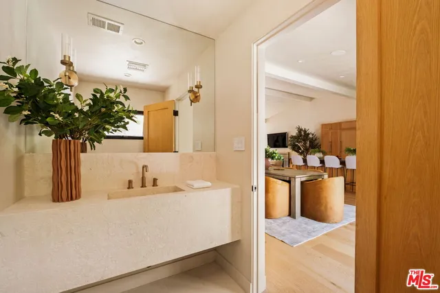 an outdoor living area with furniture and a rug