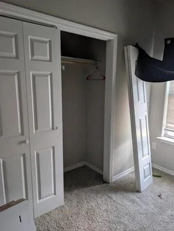 an entryway door with a rug