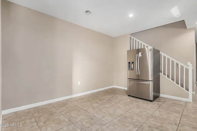 a view of kitchen with refrigerator