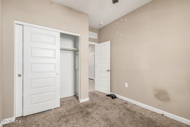 an empty room with closet