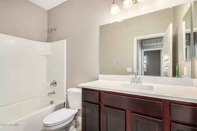 a bathroom with a sink a toilet and bathtub