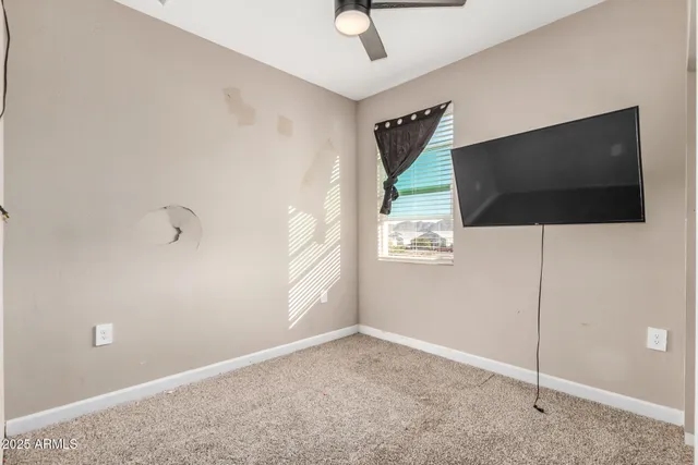 a view of a livingroom with wooden floor and cabinet
