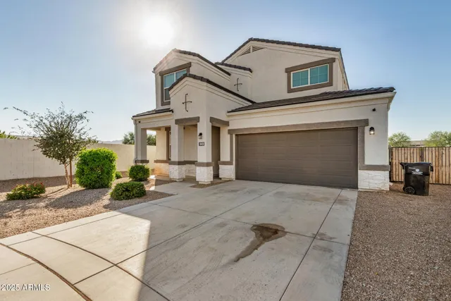 a front view of a house with a garage