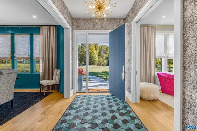 a living room with fireplace furniture and a flat screen tv