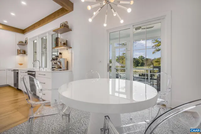 a bedroom with a bed and large windows