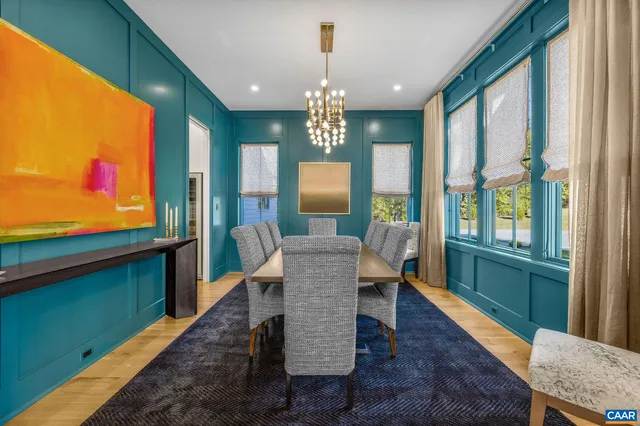 a view of a workspace with furniture and a flat screen tv