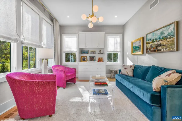 a bedroom with a bed chair and window