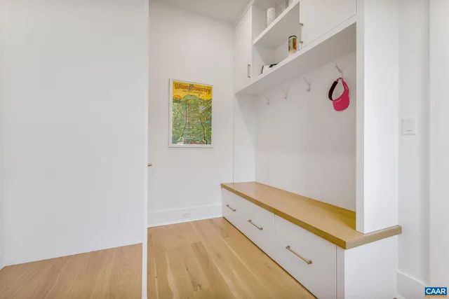 a view of a house with brick walls and a small yard