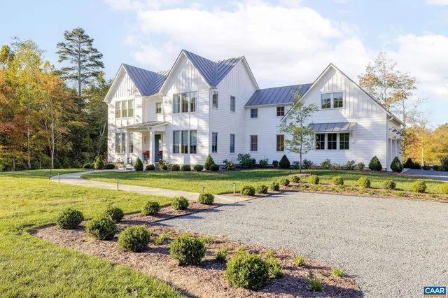 a view of a house with a yard porch and sitting area