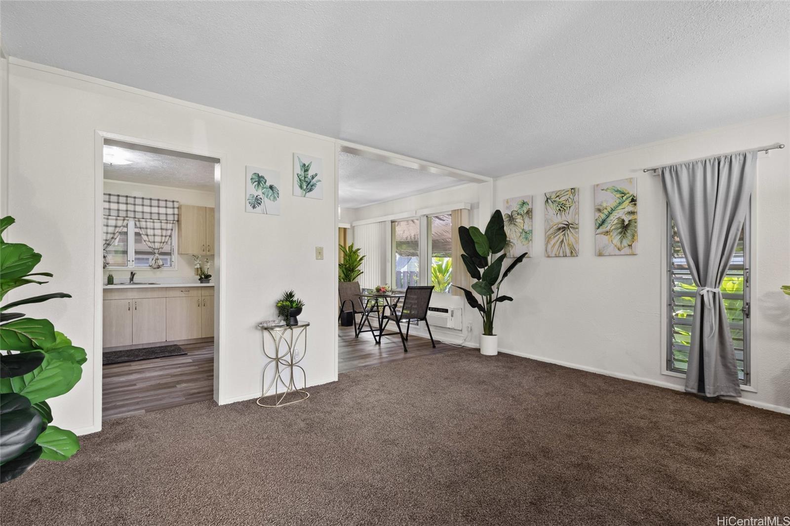 87-155 St John's Road Waianae, HI 96792 - Photo 3 of 25 Welcome to the living room, dining and view of kitchen as you enter.