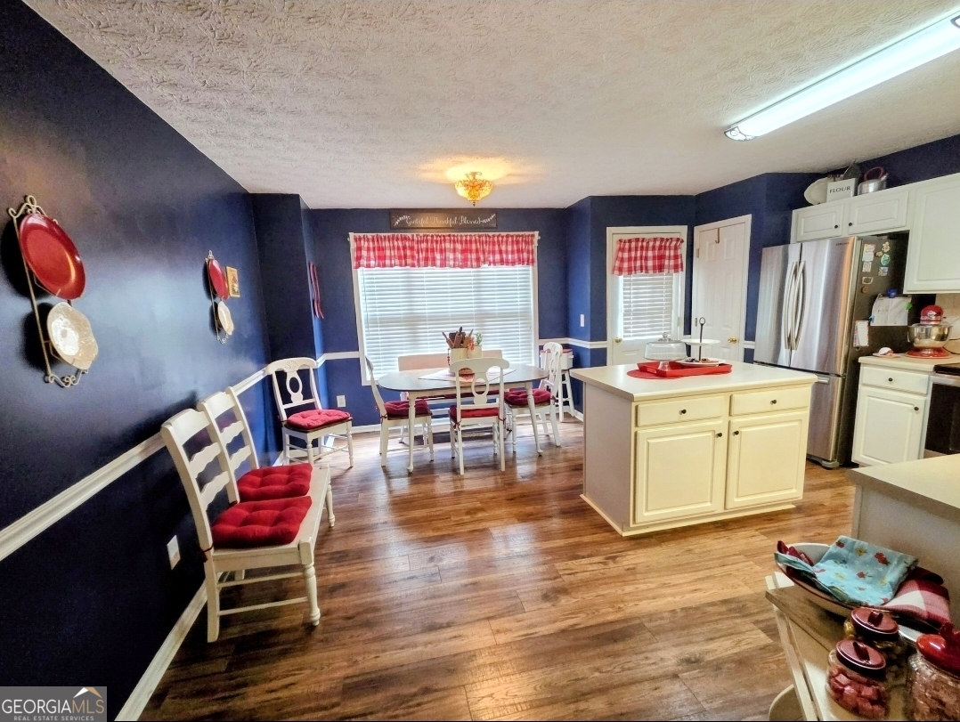 21 Baskin Heights Path Temple, GA 30179 - Photo 16 of 44 a living room with furniture and kitchen space