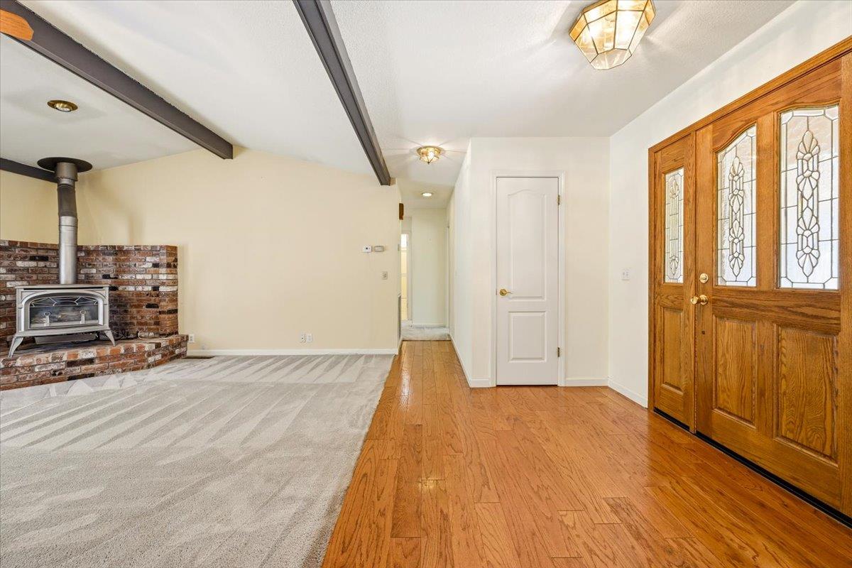 12600 Friar Tuck Road Grass Valley, CA 95949 - Photo 9 of 56 a view of a livingroom with wooden floor and stairs