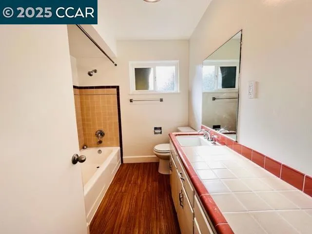 a bathroom with a tub and a shower