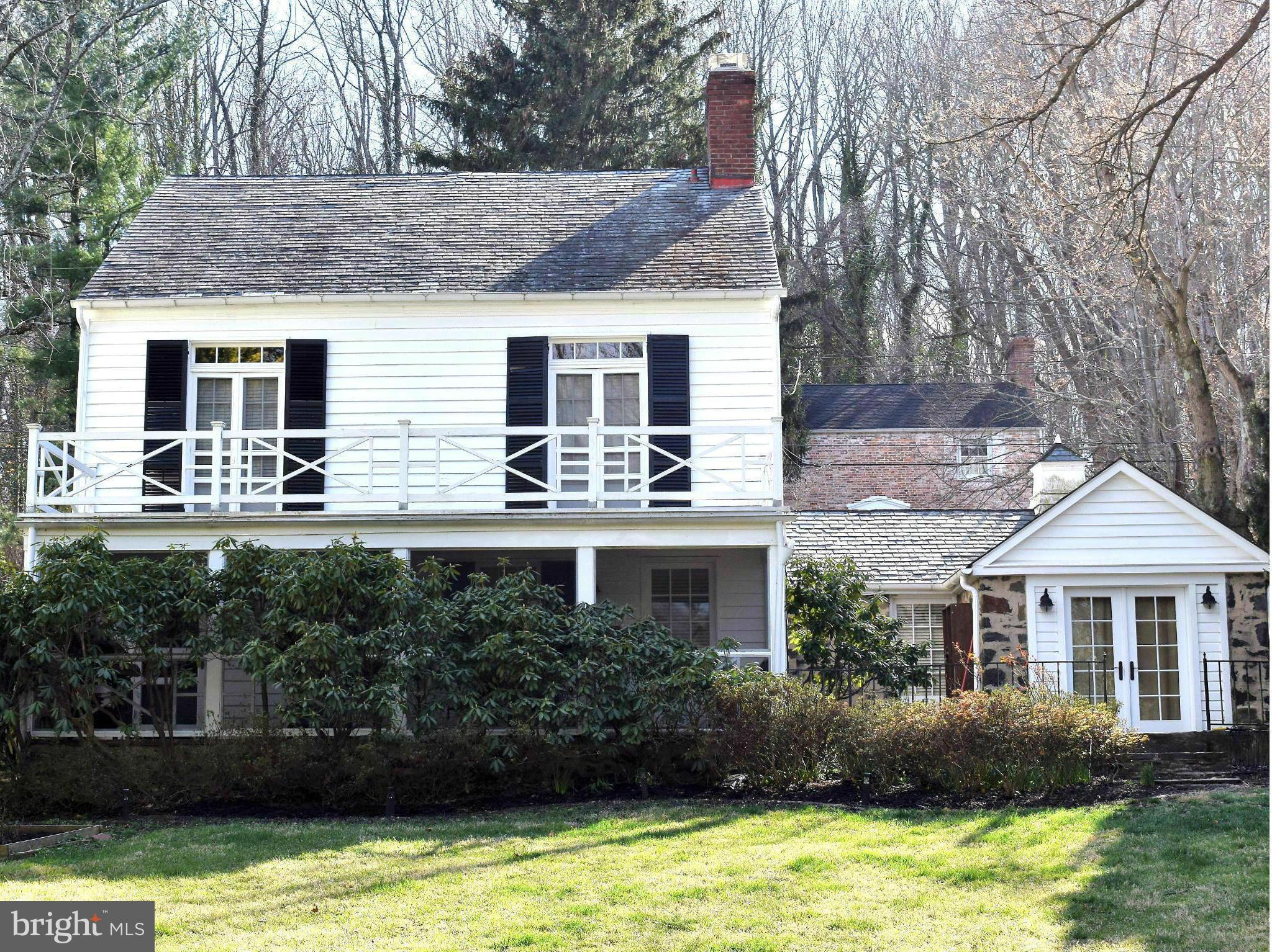 2539 Pickwick Road Baltimore, MD 21207 - Photo 1 of 30 a front view of a house with a yard and a large tree
