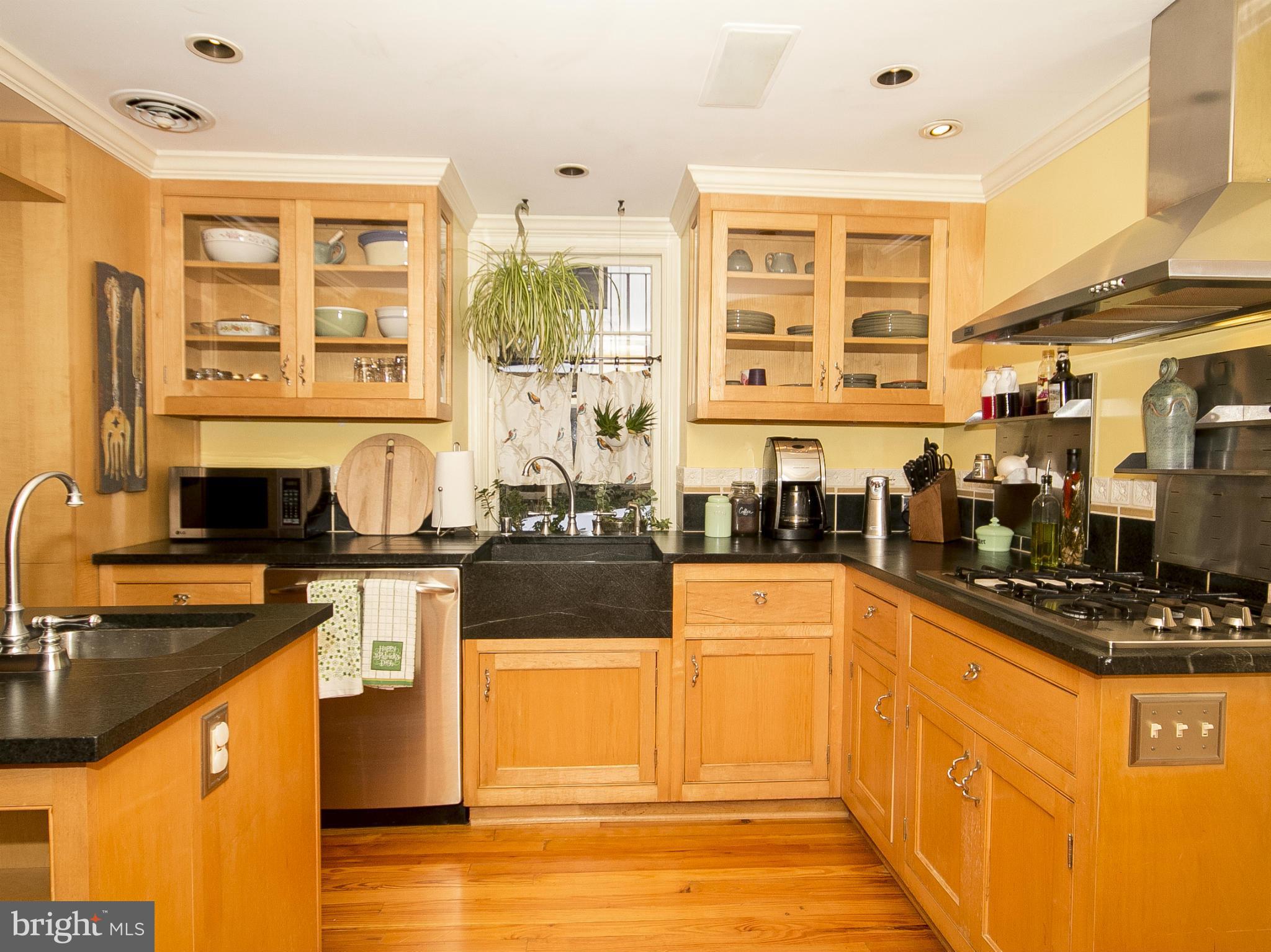 2539 Pickwick Road Baltimore, MD 21207 - Photo 14 of 30 a kitchen with stainless steel appliances granite countertop a stove and a sink