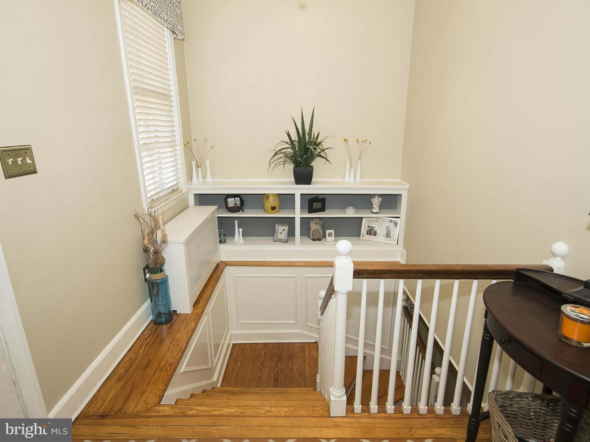 2539 Pickwick Road Baltimore, MD 21207 - Photo 19 of 30 a view of a balcony with wooden floor and a potted plant