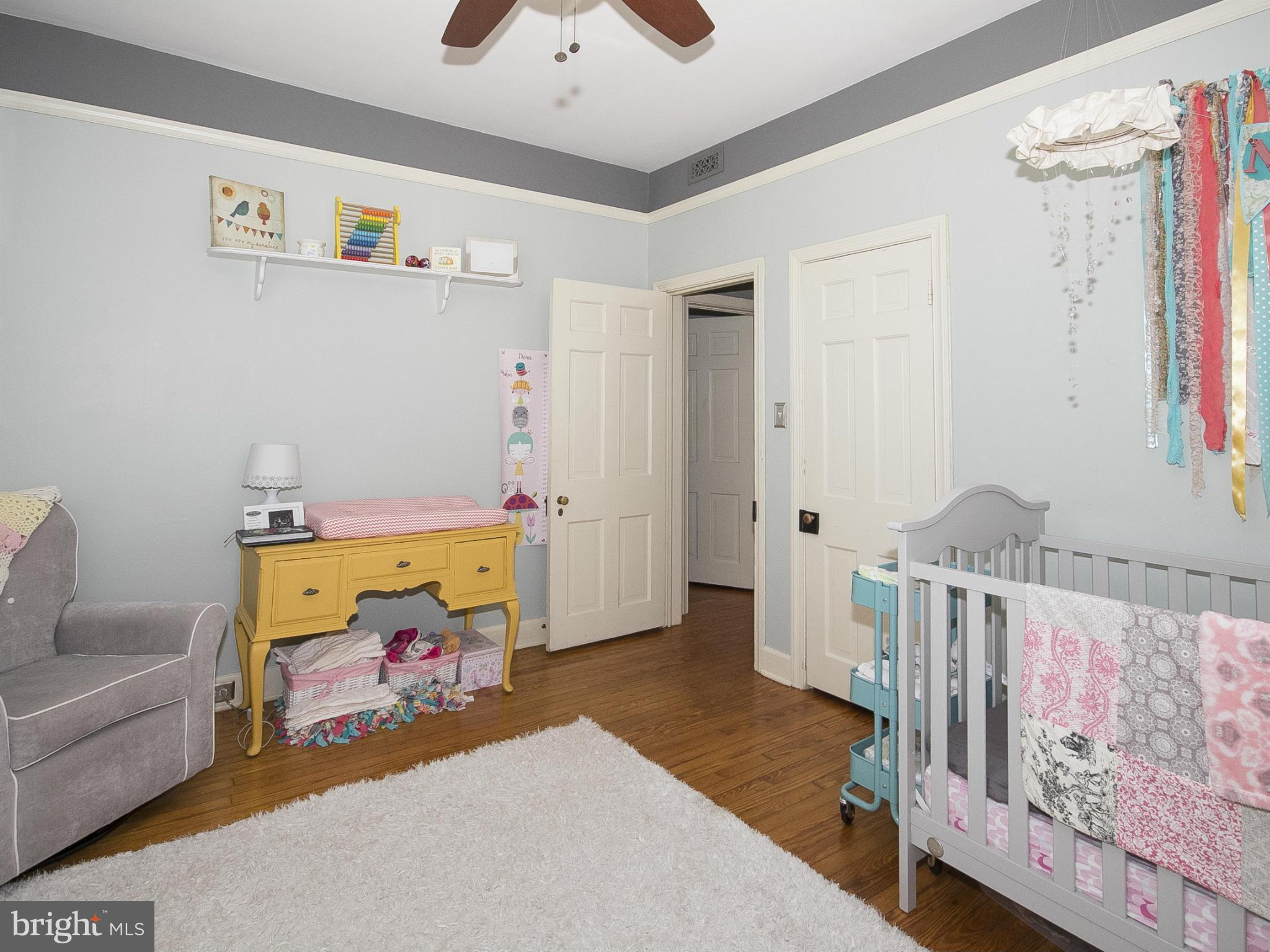 2539 Pickwick Road Baltimore, MD 21207 - Photo 23 of 30 a bedroom with furniture and a couch