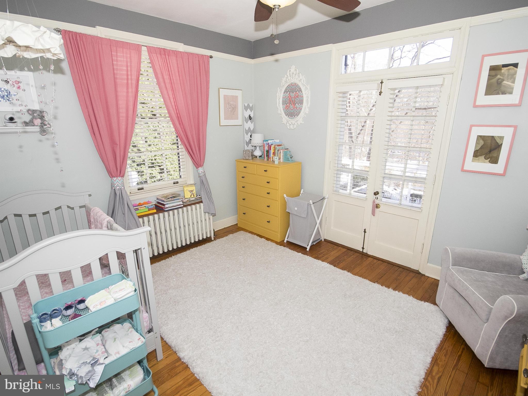 2539 Pickwick Road Baltimore, MD 21207 - Photo 24 of 30 a bedroom with a bed and a window
