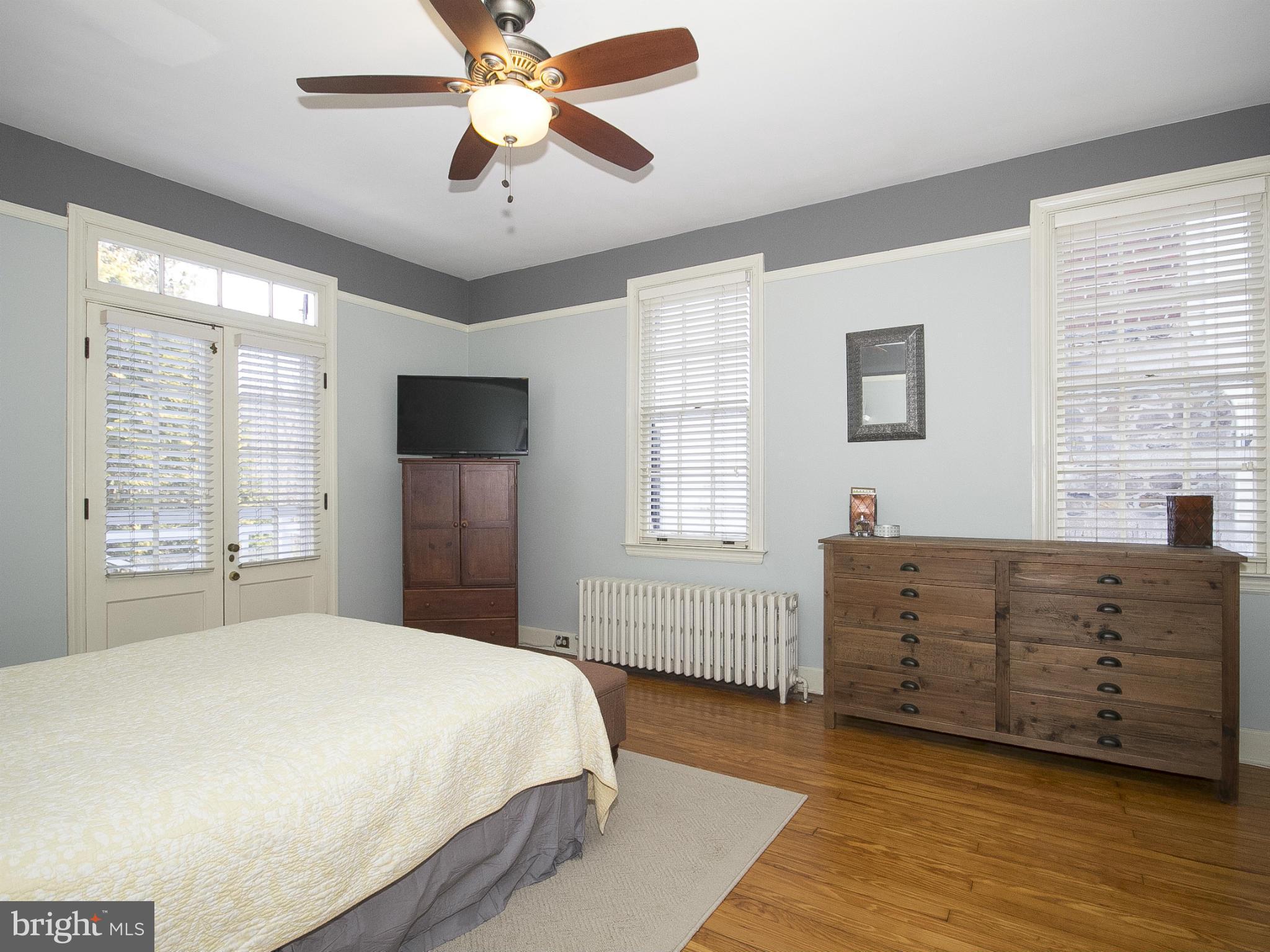 2539 Pickwick Road Baltimore, MD 21207 - Photo 25 of 30 a bedroom with a bed dresser and a window