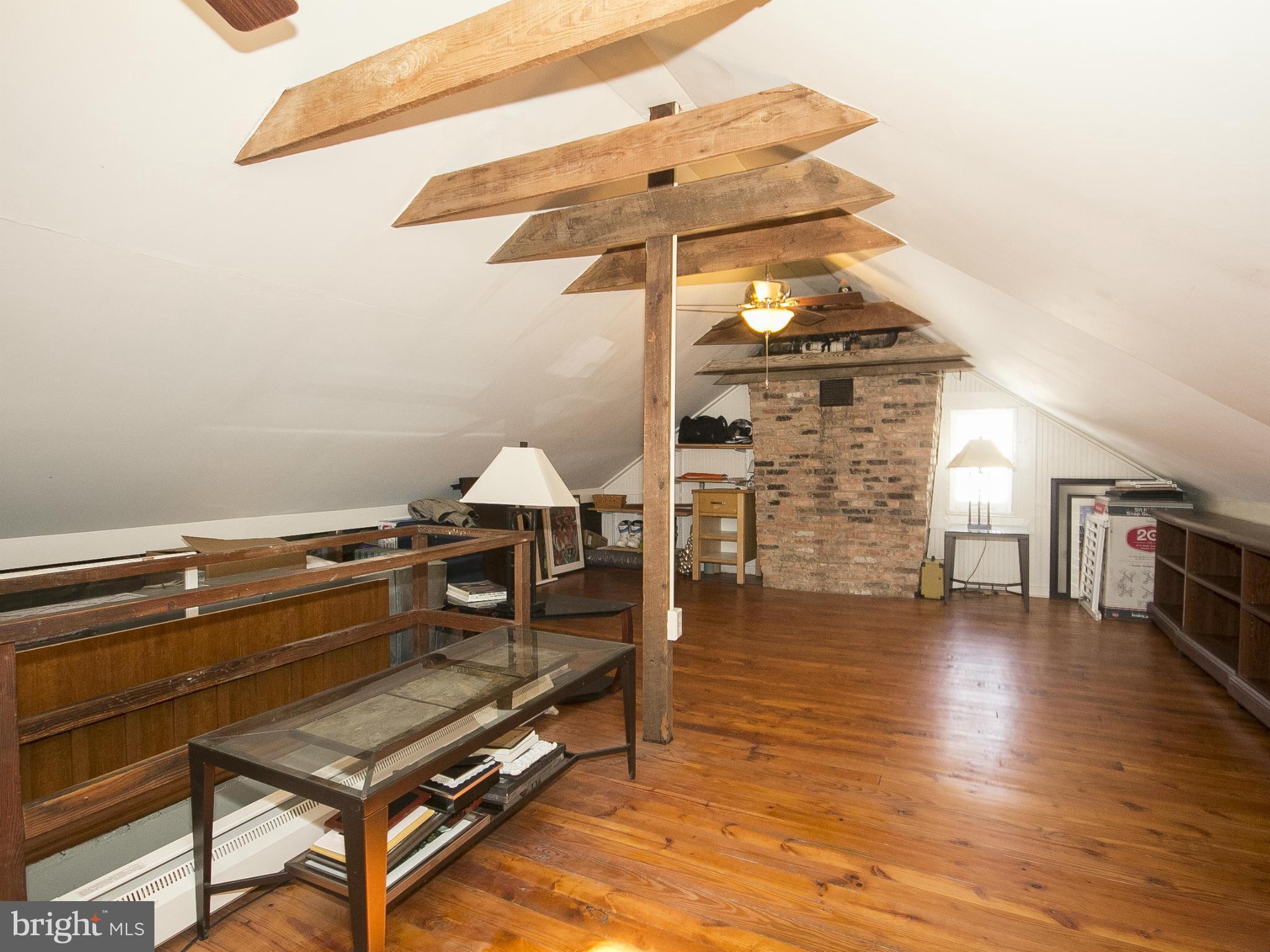 2539 Pickwick Road Baltimore, MD 21207 - Photo 30 of 30 a roof deck with table and chairs with wooden floor