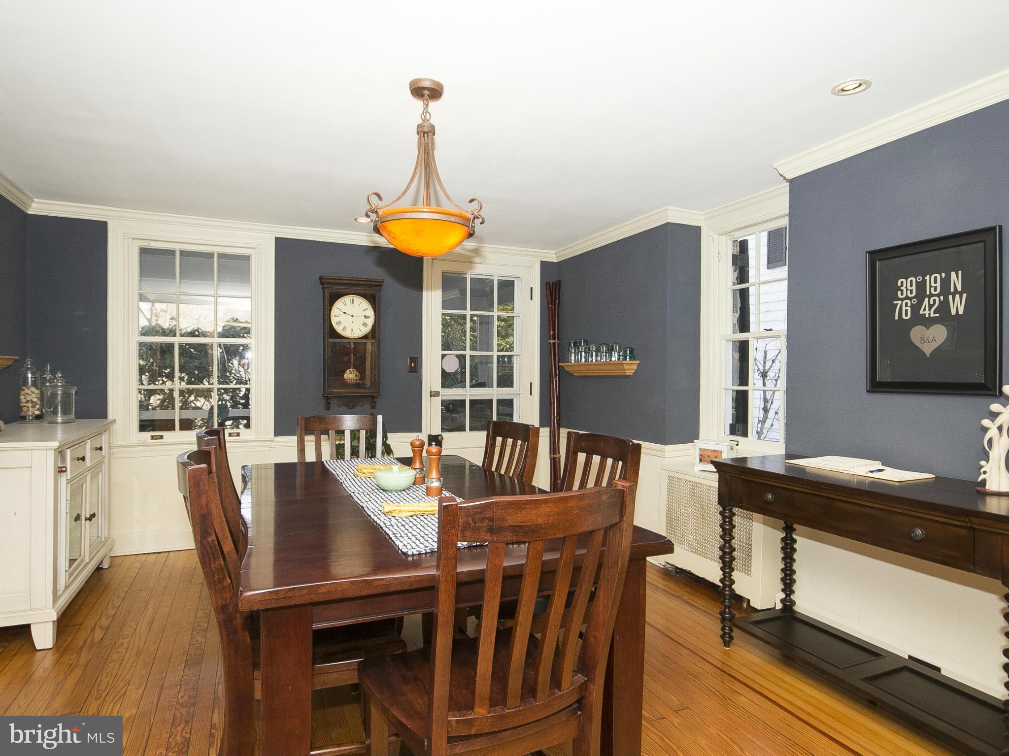 2539 Pickwick Road Baltimore, MD 21207 - Photo 9 of 30 a view of a dining room with furniture window and wooden floor