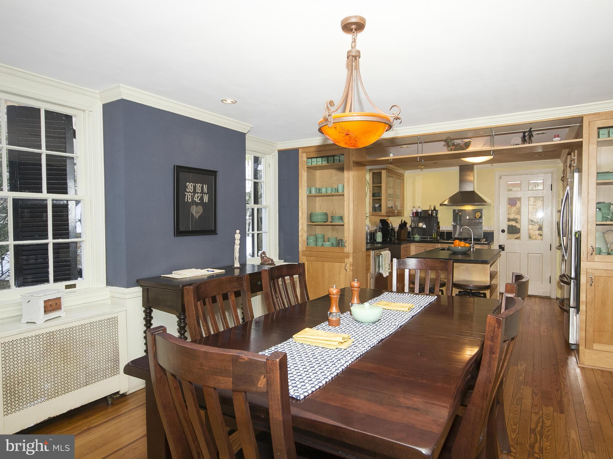 2539 Pickwick Road Baltimore, MD 21207 - Photo 10 of 30 a view of a dining room with furniture window and wooden floor