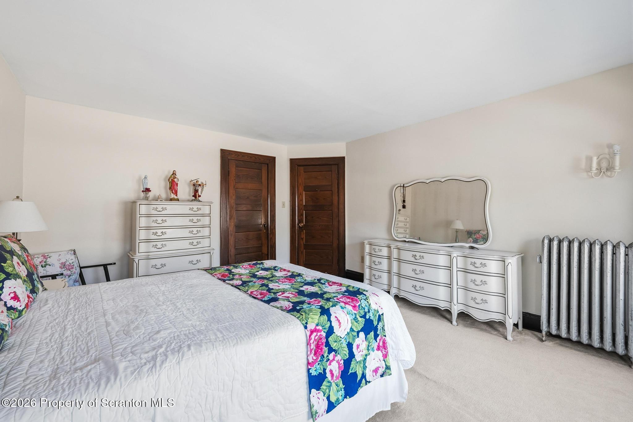 616 Myrtle Street Scranton, PA 18510 - Photo 26 of 65 a bedroom with a bed and dresser