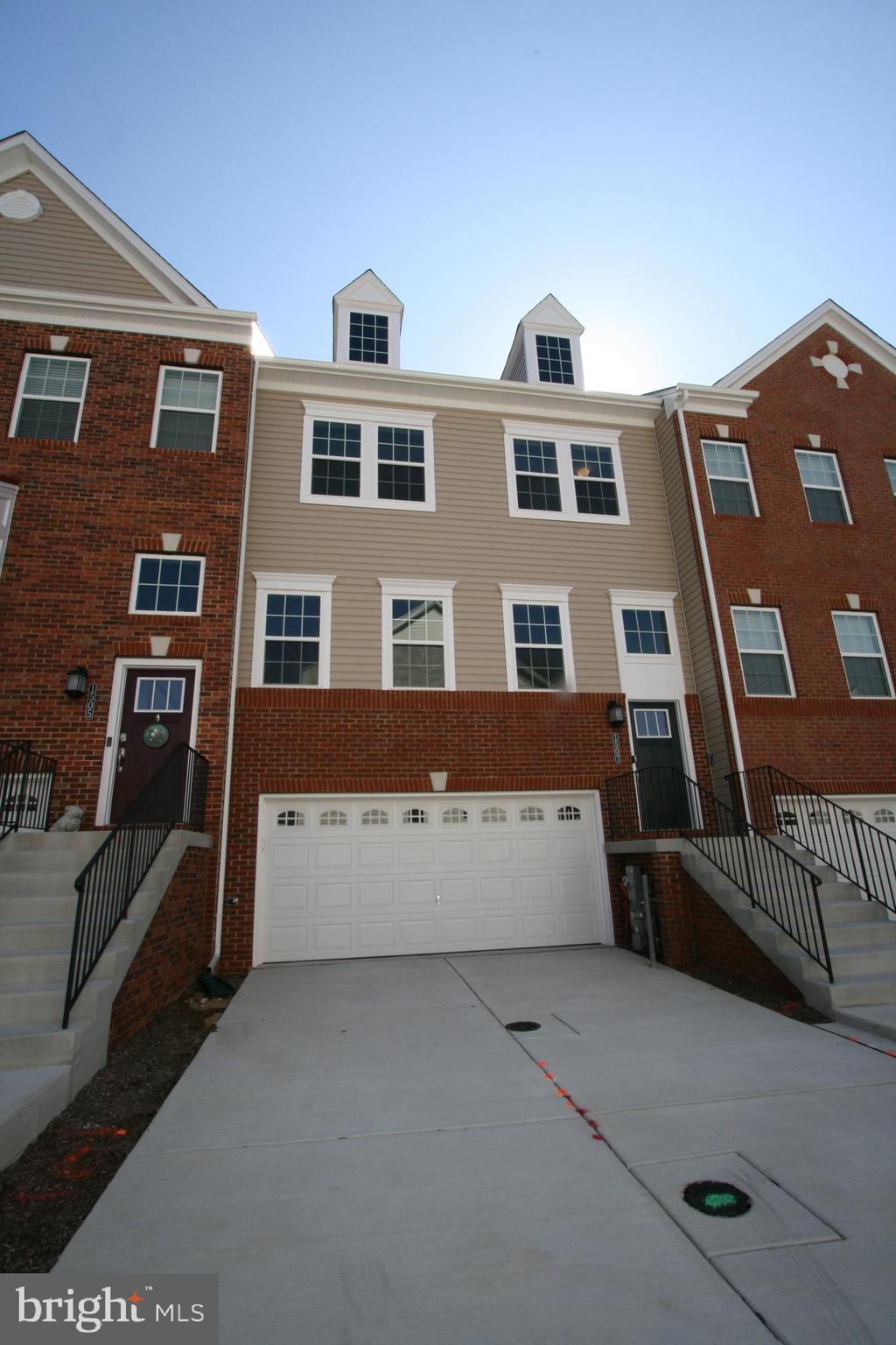 1016 Bluebells Road Gambrills, MD 21054 - Photo 1 of 52 a front view of a building with parking area