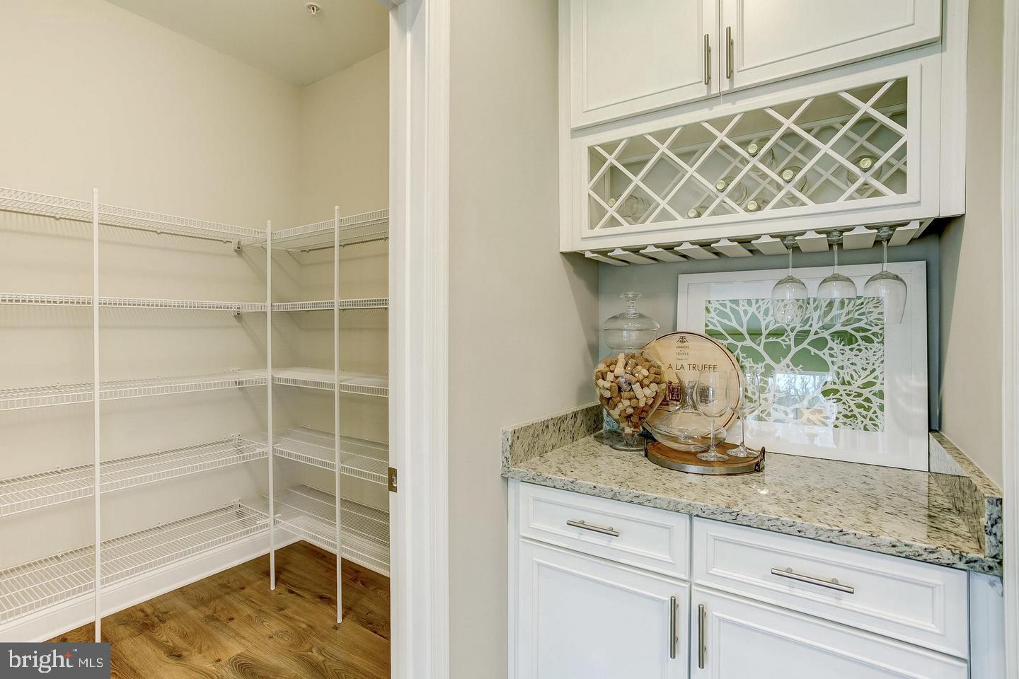 1016 Bluebells Road Gambrills, MD 21054 - Photo 20 of 52 a bathroom with a granite countertop sink a mirror and shower