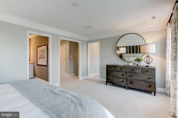 a bed room with a bed and a dresser