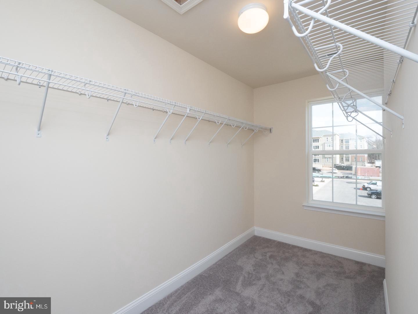 1016 Bluebells Road Gambrills, MD 21054 - Photo 34 of 52 a view of a room with racks on the wall and a window