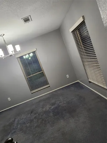 a view of empty room with windows