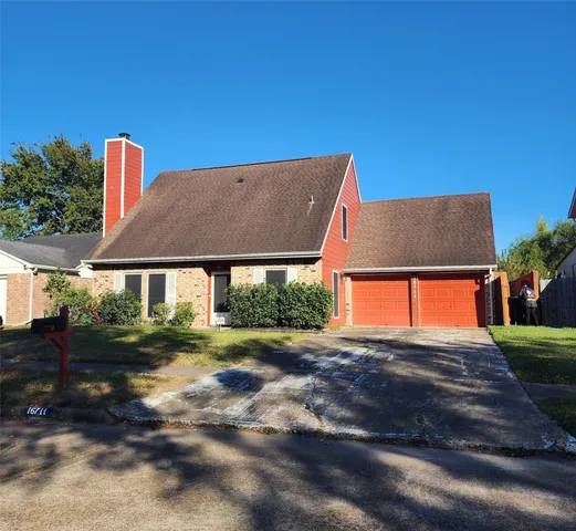 a view of backyard with large trees