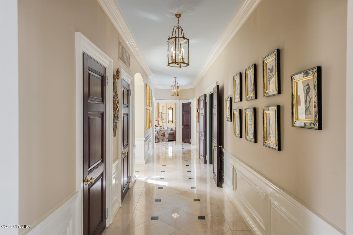16 Rock Ridge Avenue Greenwich, CT 06831 - Photo 12 of 57 a view of a hallway with windows