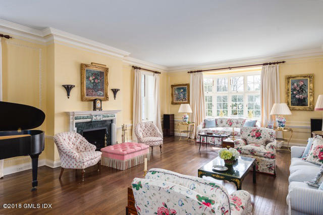 16 Rock Ridge Avenue Greenwich, CT 06831 - Photo 13 of 57 a living room with furniture or couch and a fireplace