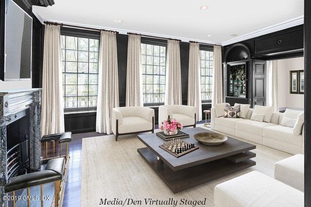 16 Rock Ridge Avenue Greenwich, CT 06831 - Photo 17 of 57 a living room with furniture fireplace and a flat screen tv