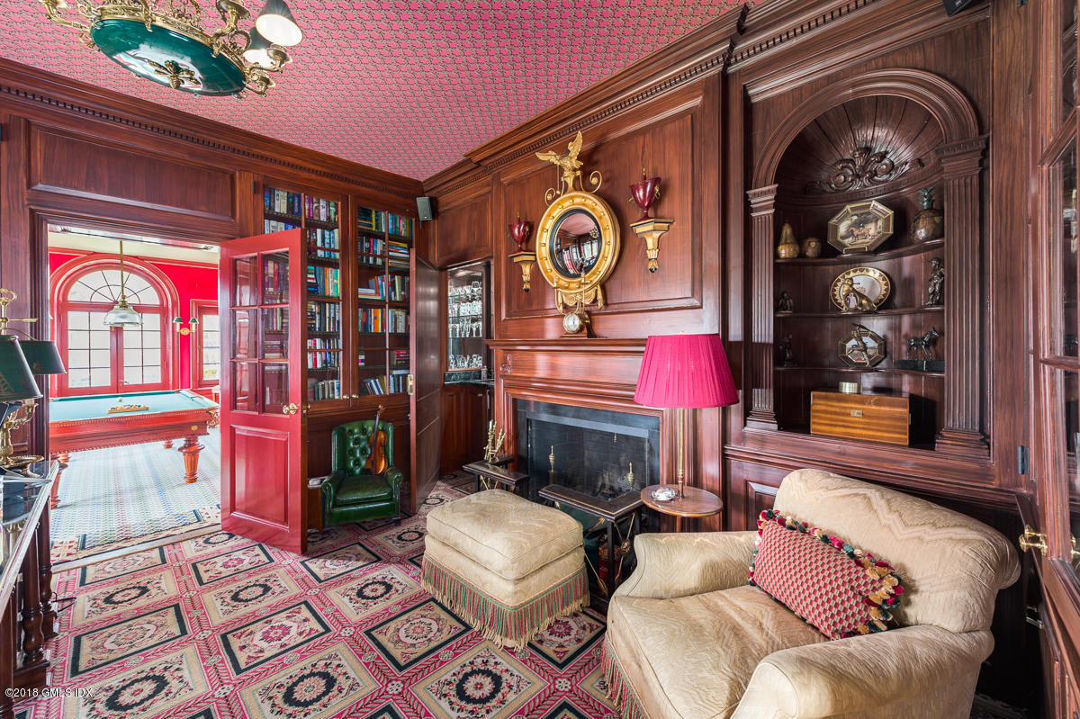 16 Rock Ridge Avenue Greenwich, CT 06831 - Photo 19 of 57 a living room with furniture and a fireplace