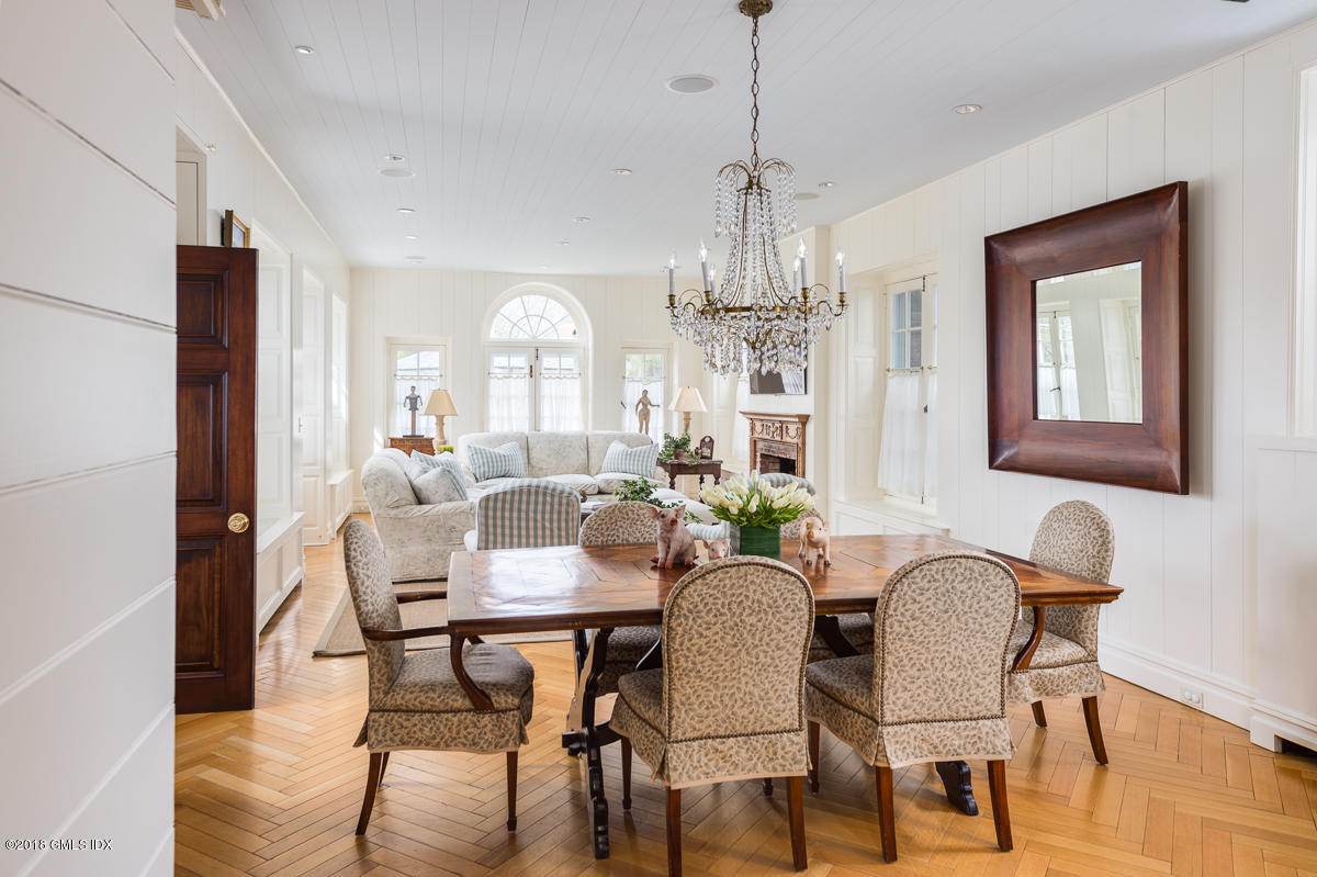 16 Rock Ridge Avenue Greenwich, CT 06831 - Photo 29 of 57 a view of a dining room with furniture window and wooden floor