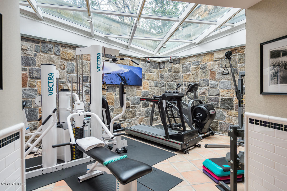 16 Rock Ridge Avenue Greenwich, CT 06831 - Photo 32 of 57 a view of a room with gym equipment