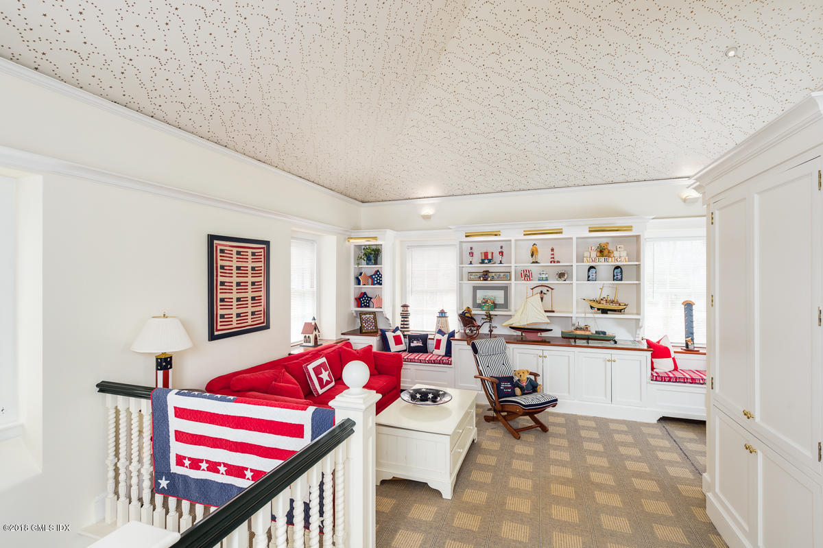16 Rock Ridge Avenue Greenwich, CT 06831 - Photo 33 of 57 a bedroom with furniture and a large window