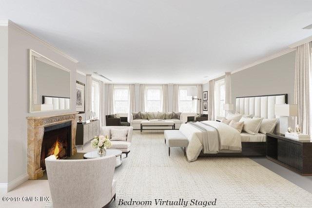 16 Rock Ridge Avenue Greenwich, CT 06831 - Photo 35 of 57 a living room with furniture and a fireplace