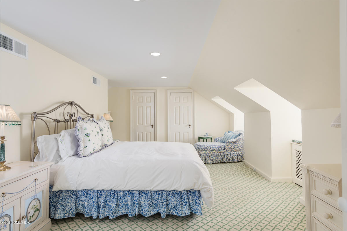 16 Rock Ridge Avenue Greenwich, CT 06831 - Photo 36 of 57 a bedroom with a bed and a closet